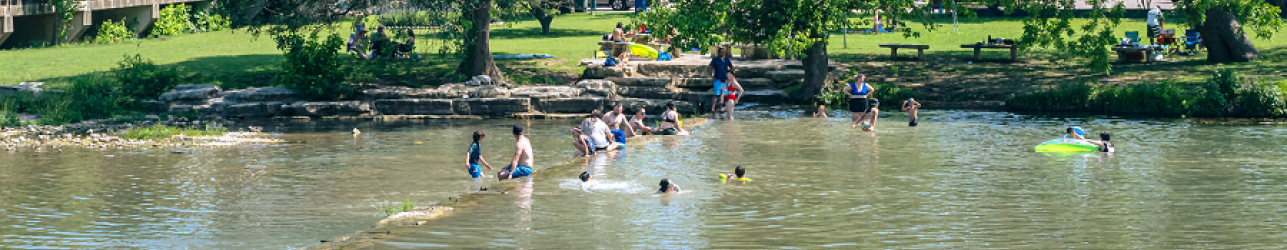 People swimming in Salado Creek