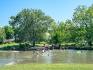 People swimming in Salado Creek at Sirena Park