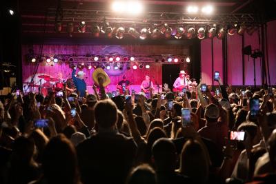 Picture of band playing at a stage at Johnnys